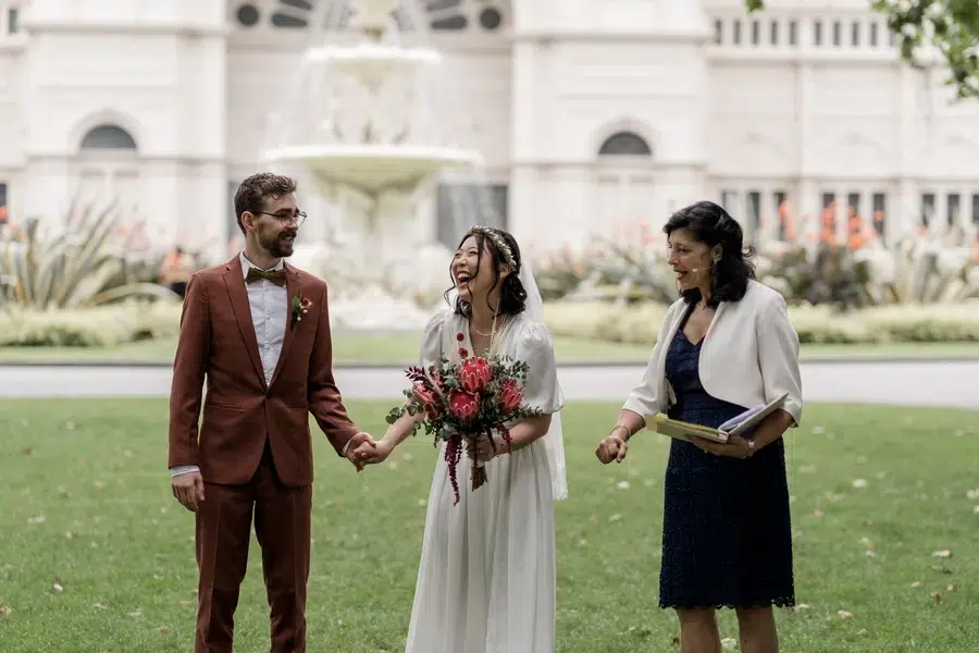 Bride-and-groom-with-officiant