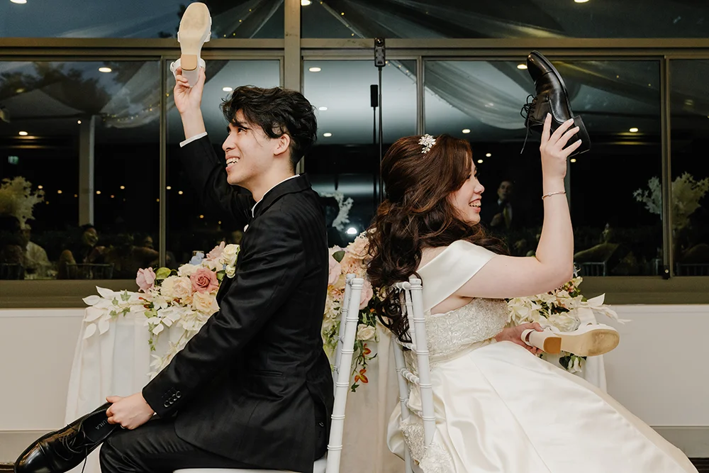 couple playing wedding shoe game at Waterview Bicentennial Park