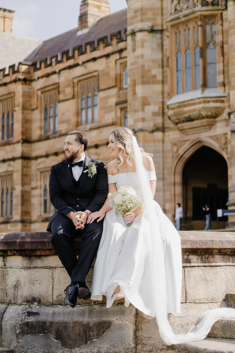Bride and groom sharing a candid moment at University of Sydney