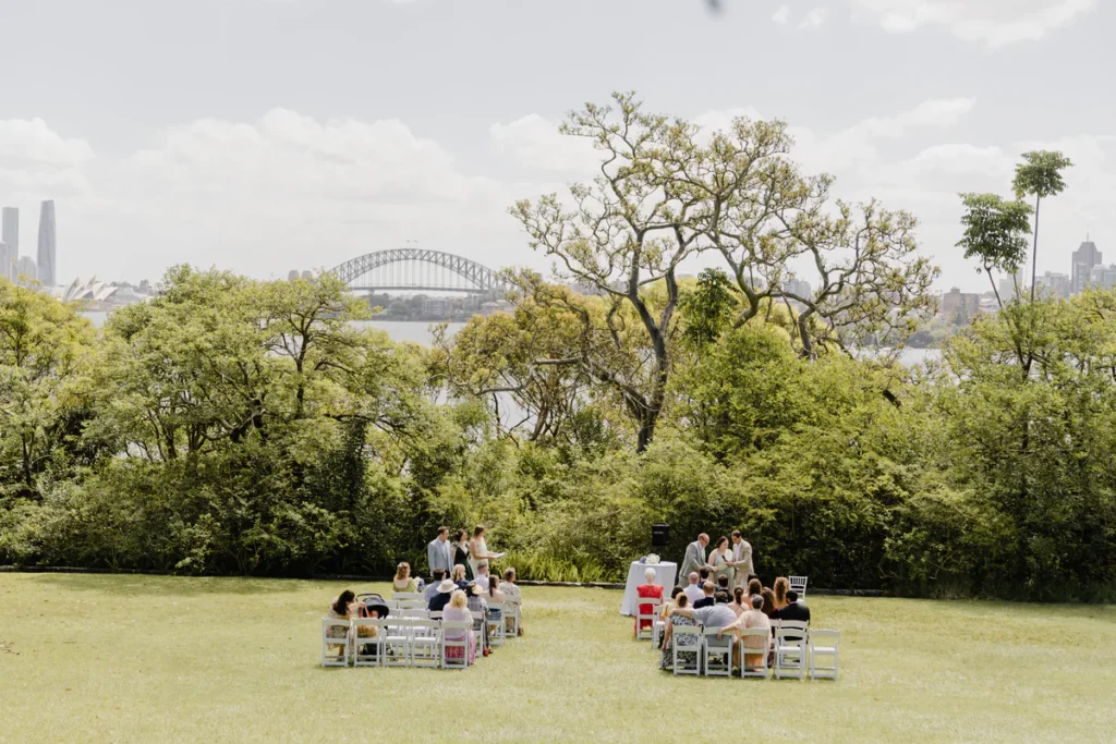 Athol Hall wedding ceremony on the lawn with Sydney Harbour Bridge in the background