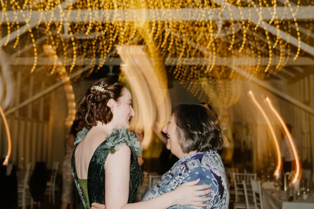 Guests dancing at Athol Hall wedding reception under fairy lights