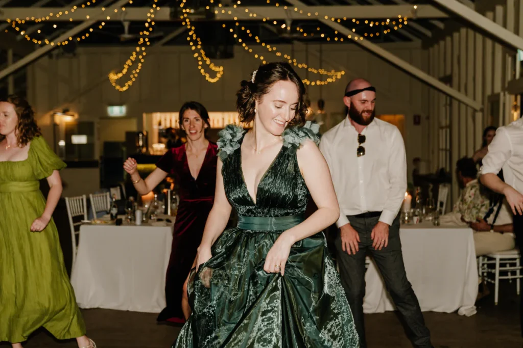 Guests dancing at Athol Hall wedding reception under fairy lights