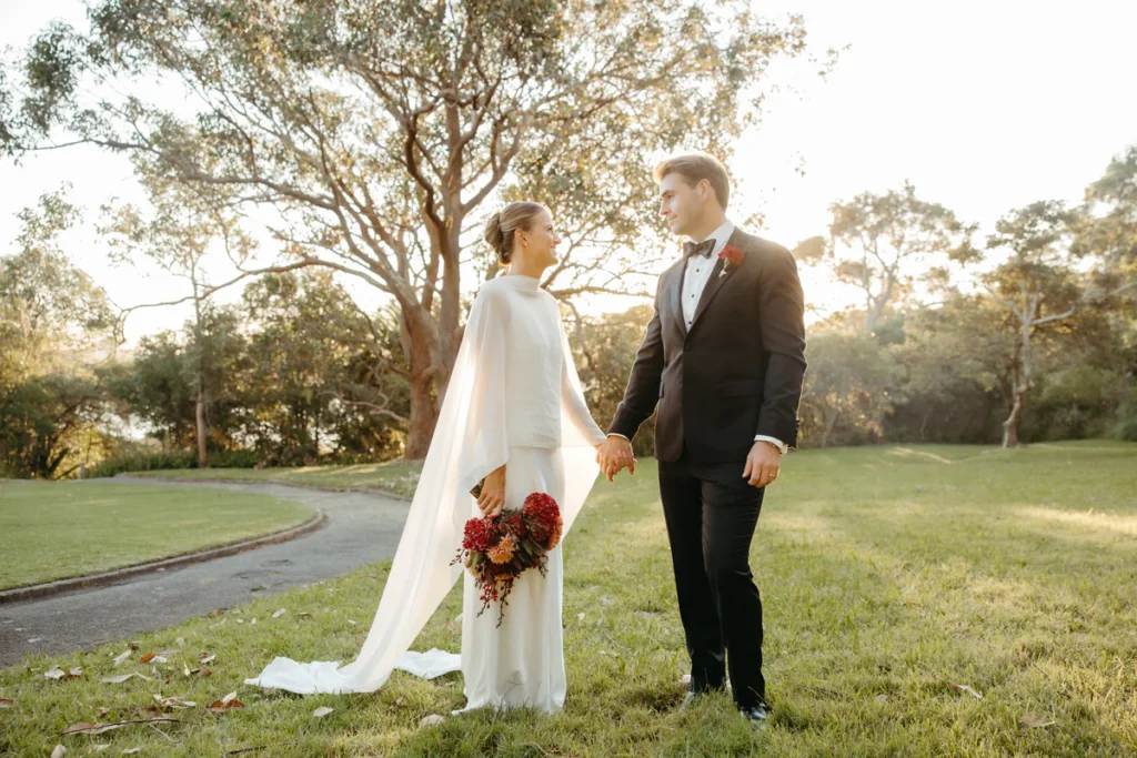 Bride and groom portrait on the foreshore pathway at Athol Hall at golden hour