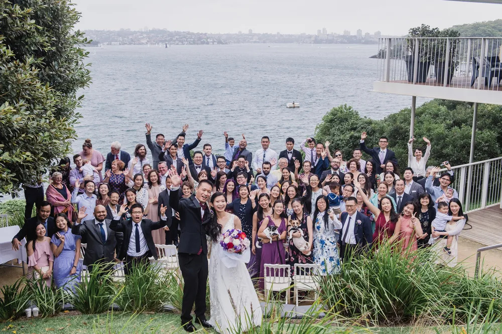 couple take photo with guests after ceremony at sergeants mess harbourside amphitheatre