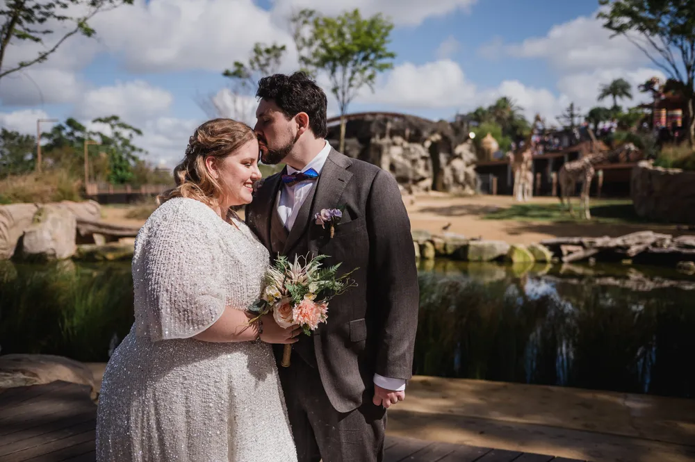 couple take photos in taronga zoo event centre