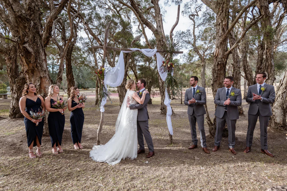 bride and groom having a kiss at the woodhouse wollombi outdoor ceremony area